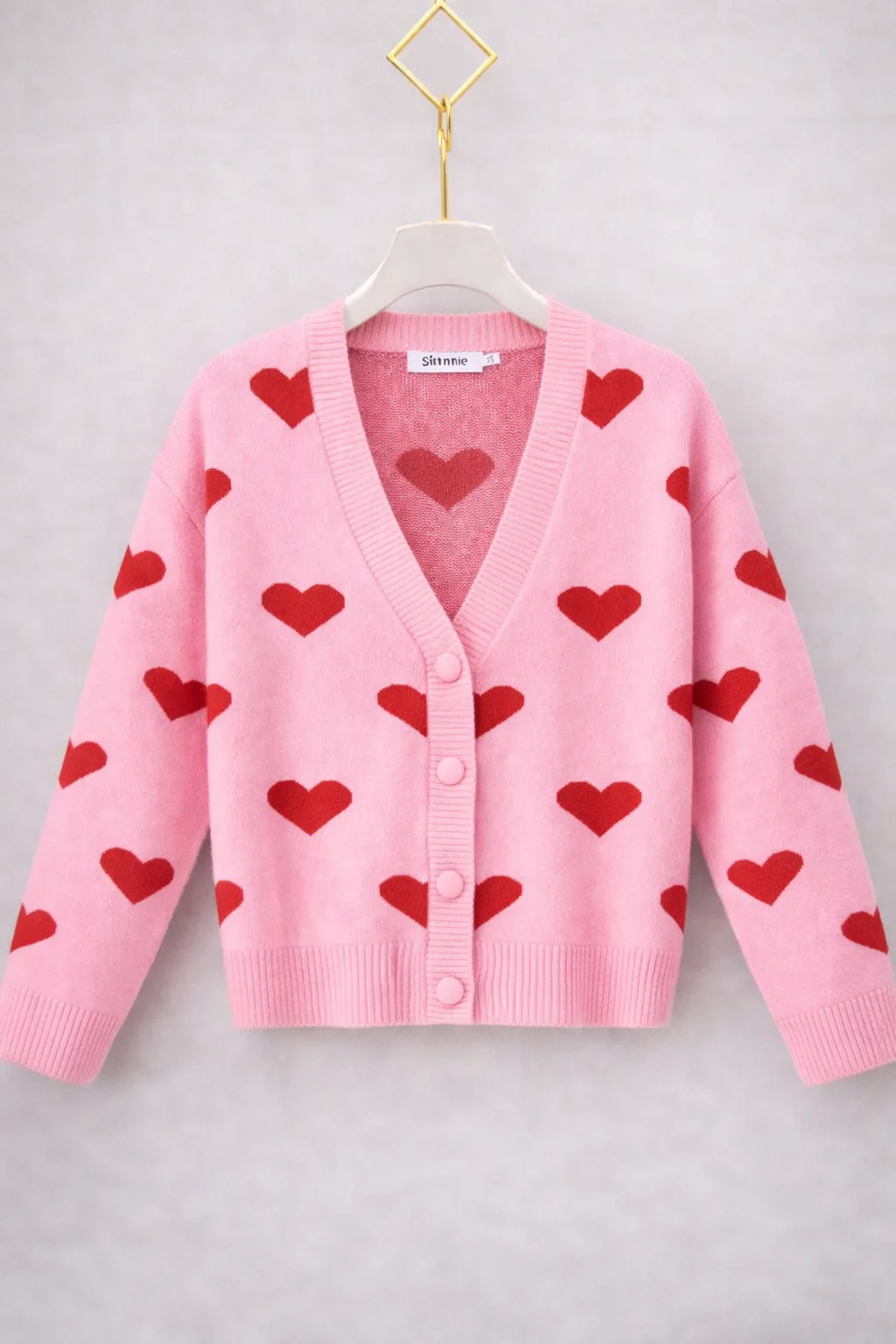 Gebreid damesvest roze met chocoladebruine hartjes